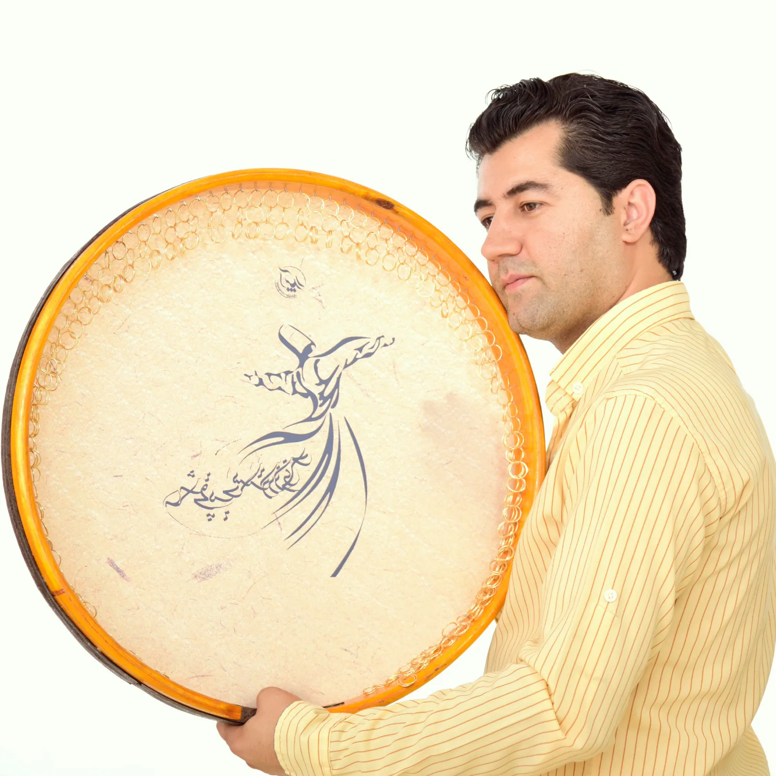 Farid Zandi holding a Daf in a studio portrait.